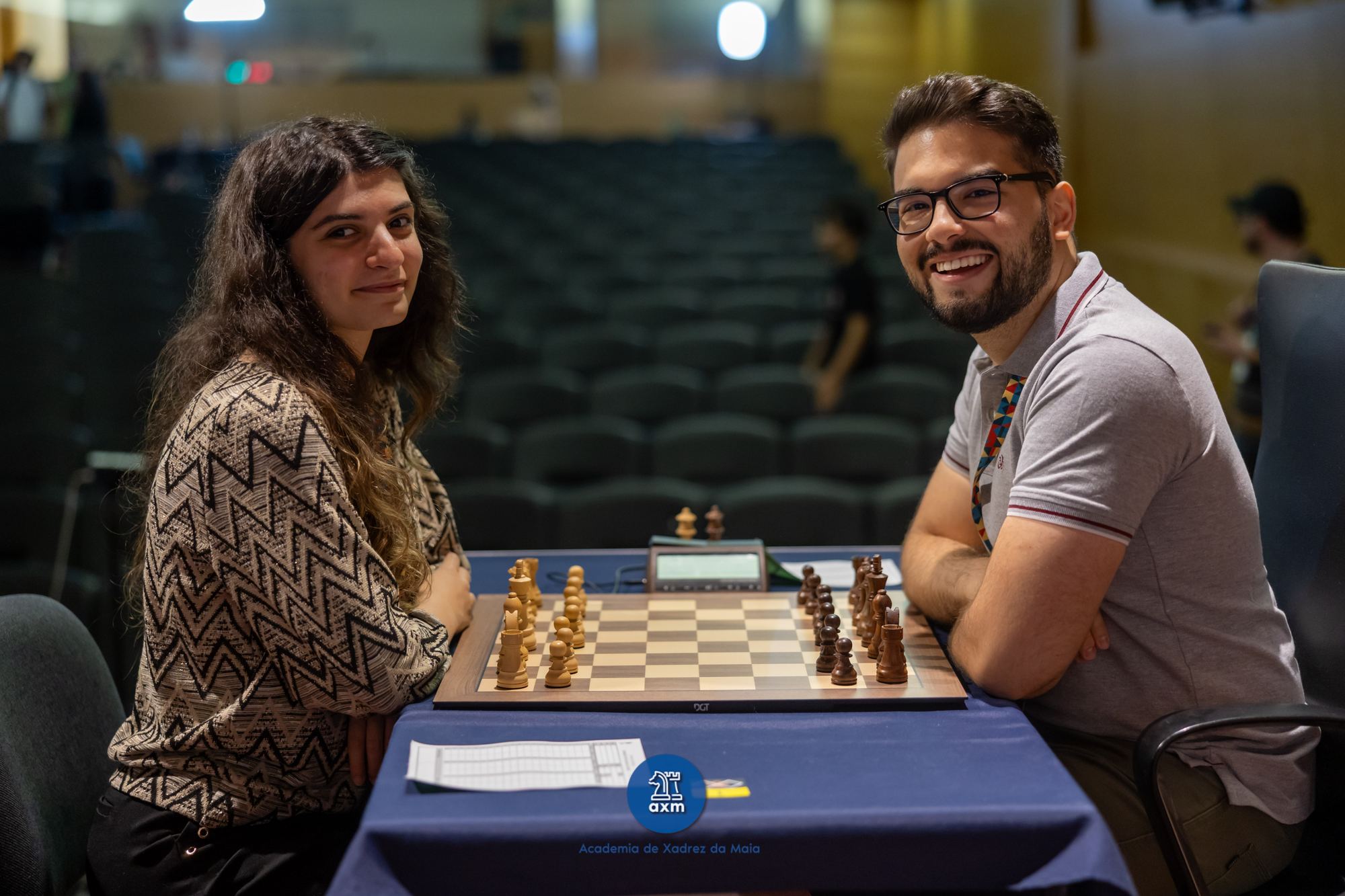 João Guilherme Matos with Anna-Maja, chess player and streamer, at the board during a tournament