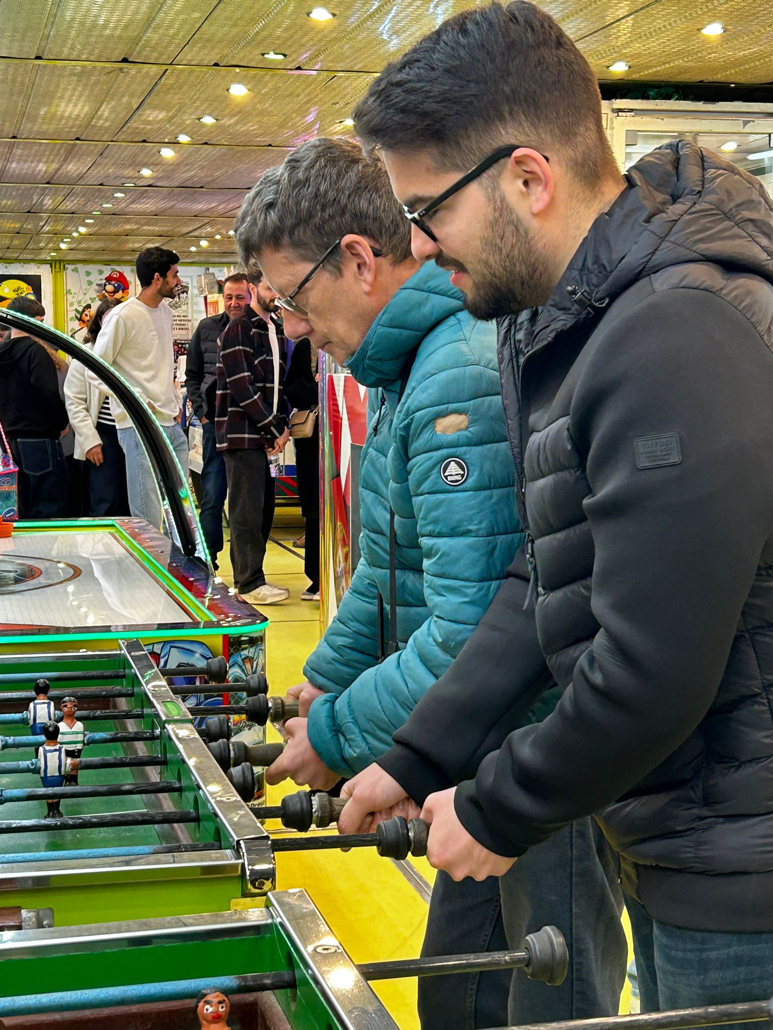 João Guilherme Matos and António Fróis playing table football at a club event